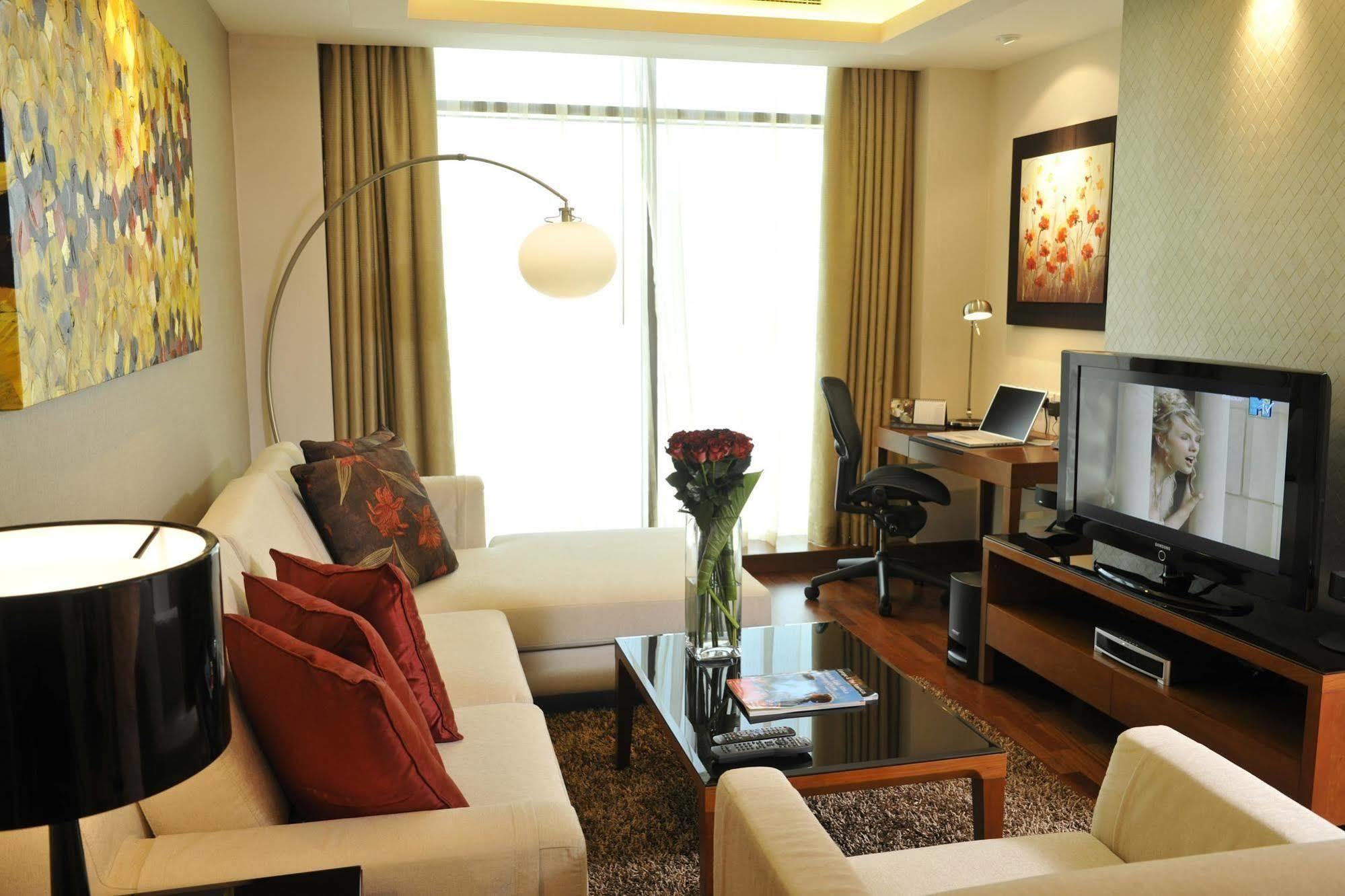 Fraser Suites Seef Bahrain Manama Zimmer foto A living room in a serviced apartment in Kuala Lumpur, Malaysia